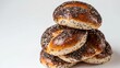 Insulated buns made of yeast dough with black poppy seeds. Poppy seed filling full of nuts and dried fruits. Sweet and appetizing, baked in small, wrapped pieces. stacked cake on a white background