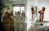 Fototapeta  - Young businesswoman leading a discussion during a meeting with her colleagues.