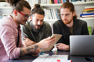 Mixed team of software engineers brainstorming ideas. Diverse app developers collaborating as group