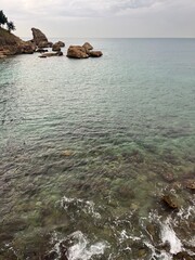 Wall Mural - Rocky sea coast, cloudy sea view