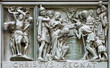 MILAN, ITALY - SEPTEMBER 16, 2024: The relief of Martyrdom of Pistis, Elpis and Agape, daughters of Sophia on the bronze gate of Cathedral - Duomo by Arrigo Minerbi (1937 - 1948)