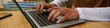 © DragonImages - Web banner with hands of student coding on laptop