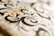 A close-up shot of a Swoop calligraphy sign with an intricate underlined hand-drawn stroke.