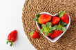 Fresh strawberries in heart bowl