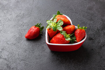Wall Mural - Fresh strawberries in heart bowl