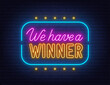 We Have a Winner Neon Sign on brick wall background.