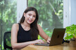 Young asian woman working with laptop. female smiling work at home chatting social network meeting online. reading email or shopping online.