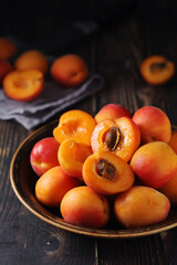 Wall Mural - Fresh ripe apricots in bowl in rustic style