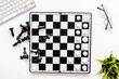 Competition in business concept. Chess board on office table, top view
