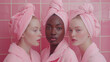 Three women dressed in bathrobes after beauty treatments, close-up portrait