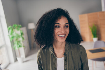 Poster - Portrait of pretty young woman toothy smile think imagine wear khaki shirt modern interior house indoors