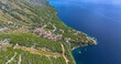 AERIAL: A quaint coastal town on Hvar island overlooks the calm Dalmatia waters
