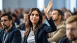 © jureephorn - Female entrepreneur raises hand to answer question during business meeting in conference room. Answer question. Raise hand to ask.