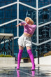 Vertical Screen: Beautiful And Fashionable Young Caucasian Woman Voguing On Street. Professional Vogue Dancer Practicing Her Choreography In Urban Environment During The Day. The Vogue Ball Concept.