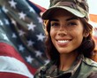 A young smiling female soldier in camouflage uniform on the background of the American flag. D-Day Anniversary.  National Flag day.