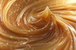 Dive into the rich, amber depths of liquid caramel, its velvety texture swirling in deliciously tempting patterns