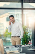 © peopleimages.com - Happy, businessman and phone call in boardroom for connection, networking and communication. Smile, male person or employee with smartphone for discussion, contact and conversation with lens flare