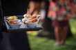 © Mujib - Food being served to guests at a party