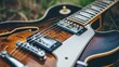  A tight shot of a fallen guitar with a hazy depiction of its neck and bridge