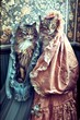 Two Majestic Maine Coon Cats Dressed in Vintage Victorian Attire Posing Elegantly