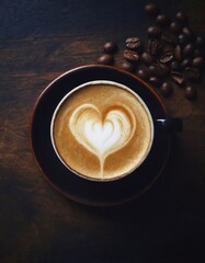  hot coffee cappuccino latte with foam top view on dark wooden background