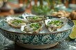 A beautifully arranged platter of oysters on ice, artistically decorated with lime slices and sea salt