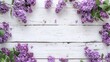 a floral backdrop, showcasing lilac flowers arranged on a white grunge wood background, offering ample copy space and a view from above, perfect for Mother's Day, Birthday, or Easter.