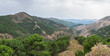 Panoramic view of a typical mountain landscape of Andalusia under a stormy sky. Malaga, Spain.

