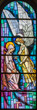 MILAN, ITALY - MARCH 6, 2024: The Annunciation on the stained glass of the church Basilica di San Babila by from 20. cent.