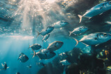 Fototapeta Lawenda - World Oceans Day. A school of fish gracefully glides through the azure underwater world. Generative AI