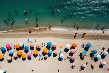 Canvas Print - Aerial view of sandy beach with colorful umbrellas, swimming people in sea bay with transparent blue water in summer. Top view
