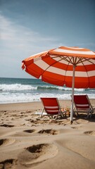 Wall Mural - A beach scene with a red and white striped umbrella and two chairs