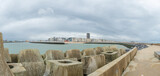 Fototapeta  - Oostende, Belgium - July 31st: View from the harbour embankment towards the skyline of the city centre