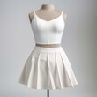 White low-rise box pleat skort miniskirt fashion apparel.