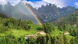Fototapeta Most - Stunning Alpine scenery of breathtaking Dolomites rocks mountains with rainbow in Italian Alps, South Tyrol Alto adige , Italy. view of Val di Funes and village Santa Maddalena .