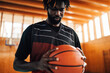 Cropped shot of a african man professional basketball player holding a ball
