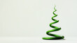 Serpentine green snake twists elegantly upwards creating spiral like as Christmas tree against minimalist white background. Symbol of new year 2025