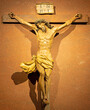 MILAN, ITALY - MARCH 6, 2024: The carved polychrome Crucifixion in the church Basilica di San Babila by unknown artist. 