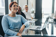 © Jacob Lund - Happy business woman listening to a business presentation in a boardroom