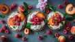   A table is laden with two tarted dishes, each generously topped with whipped cream and adorned with fresh raspberries and peaches