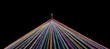 Rainbow Colored Threads Through Needle Eyelet on black background