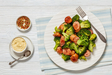 Poster - fried juicy sausage and crispy broccoli on plate