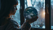 little girl with a representation of the planet earth in her hands with a surprised look - concept of caring for the environment