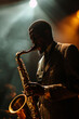 © ivlianna - A close-up portrait of a musician playing saxophone on a dimly lit stage, bathed in the glow of a single spotlight, capturing the soulful intensity of live performance. A man in suit playing sax