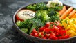 © Natalia - Simple vegetarian clean eating, steamed veggies with a light tahini dressing , close-up