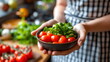 A person in a striped apron holding a bowl of vibrant tomatoes and leafy greens, ready for a healthy meal preparation - Generative AI