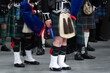 Traditional scottish bagpipers in kilts