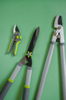  Secateurs, loppers, and hedge trimmers set.Garden tools for topiary cutting of plants. Garden equipment and tools. Tools for pruning and trimming plants