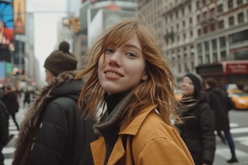 Wall Mural - Beautiful young redhead woman in the streets of New York City.