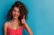 Photo of attractive curly lady bright pomade smiling good mood direct thumb finger side empty